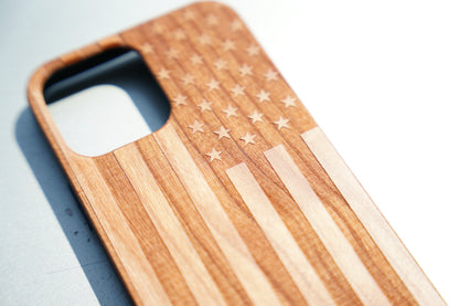 Eco-friendly wooden iPhone case with laser-engraved American flag design, MagSafe-compatible