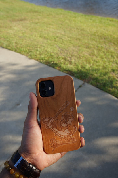 Eco-friendly wooden iPhone case with a detailed laser-engraved baseball MagSafe-compatible for easy wireless charging